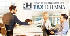 IRS tax attorney shaking hands with his tax clients after solving their problems