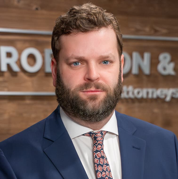 Photo of Senior Associate Adam Pienciak.